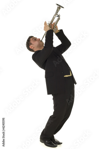 Man in suit standing and trumpet melody. Side view.