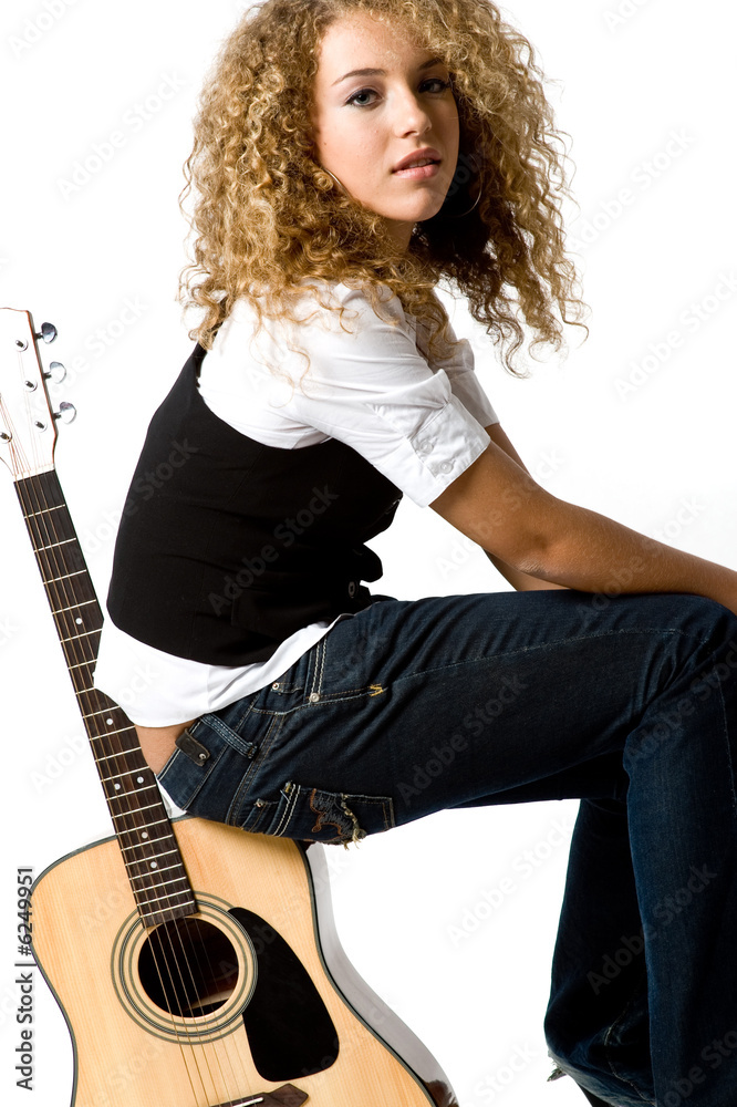 A pretty teenage girl with acoustic guiatr A pretty teenage girl with acoustic guiatr
