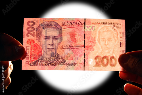 checking watermark 200 ukrainian hrivna isolated on black