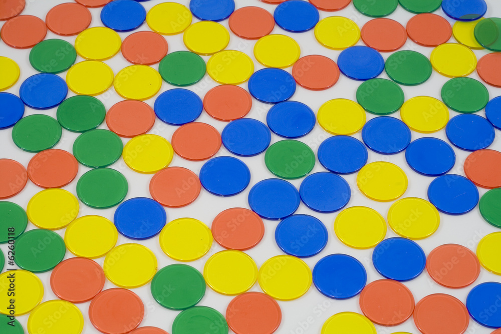 Colourfull Counters on a white background, mixed up colours
