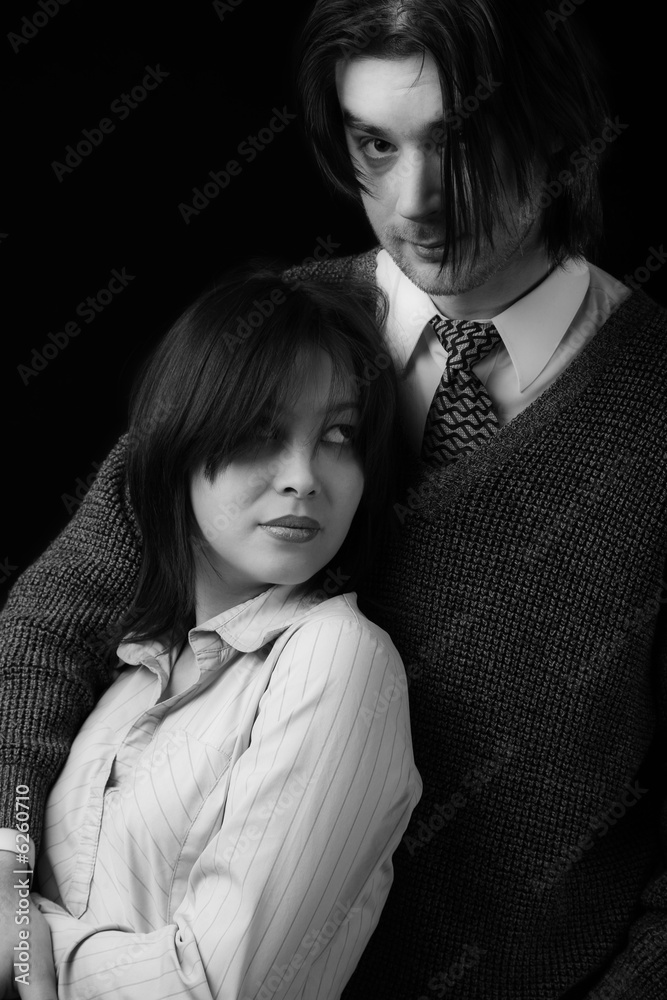 young couple isolated on black, black and white young couple isolated on black, black and white