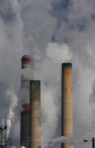 smoke stacks billowing pollution and smoke into the air