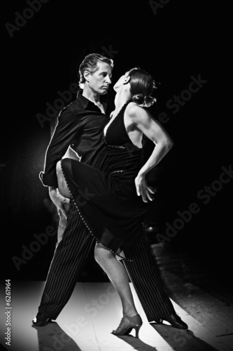 Couple dancing hot latin dance on a street at night #6261964