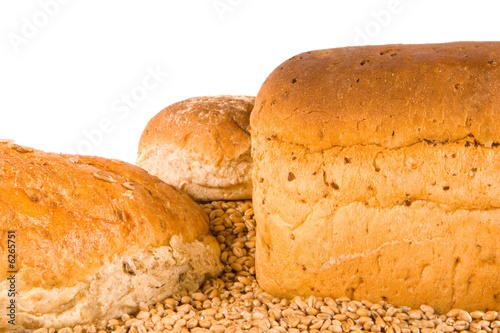 Assorted brown bread on wheat grains