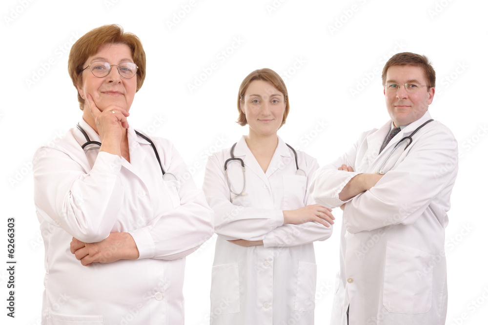 Fototapeta premium Senior female doctor and two young interns