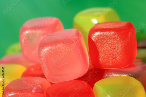 Pink, yellow and red icecubes made of plastic