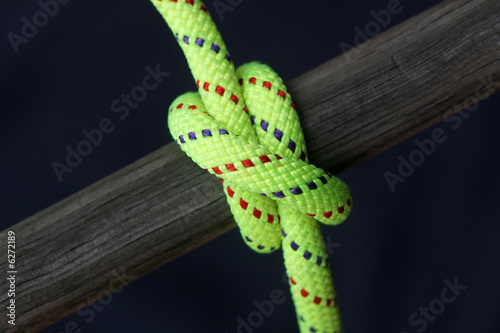 Canvas Print Bright rope tied around wood