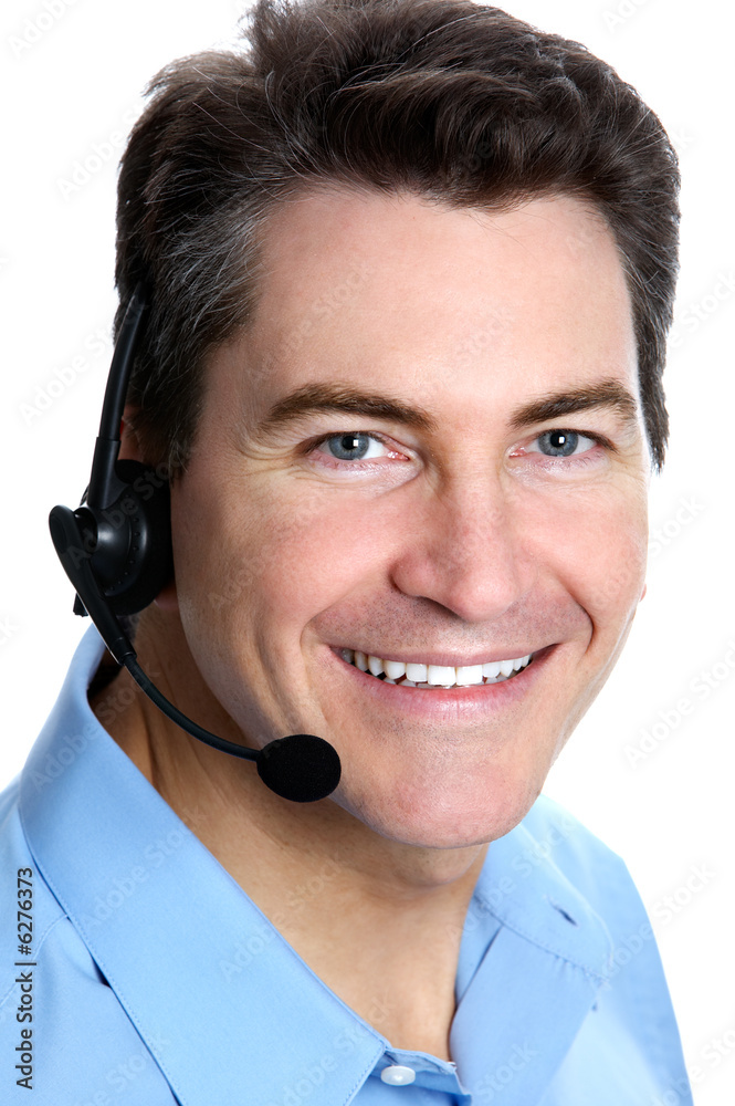 Smiling businessman with headset. Over white background . Smiling businessman with headset. Over white background .