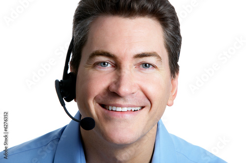 Smiling businessman with headset. Over white background .