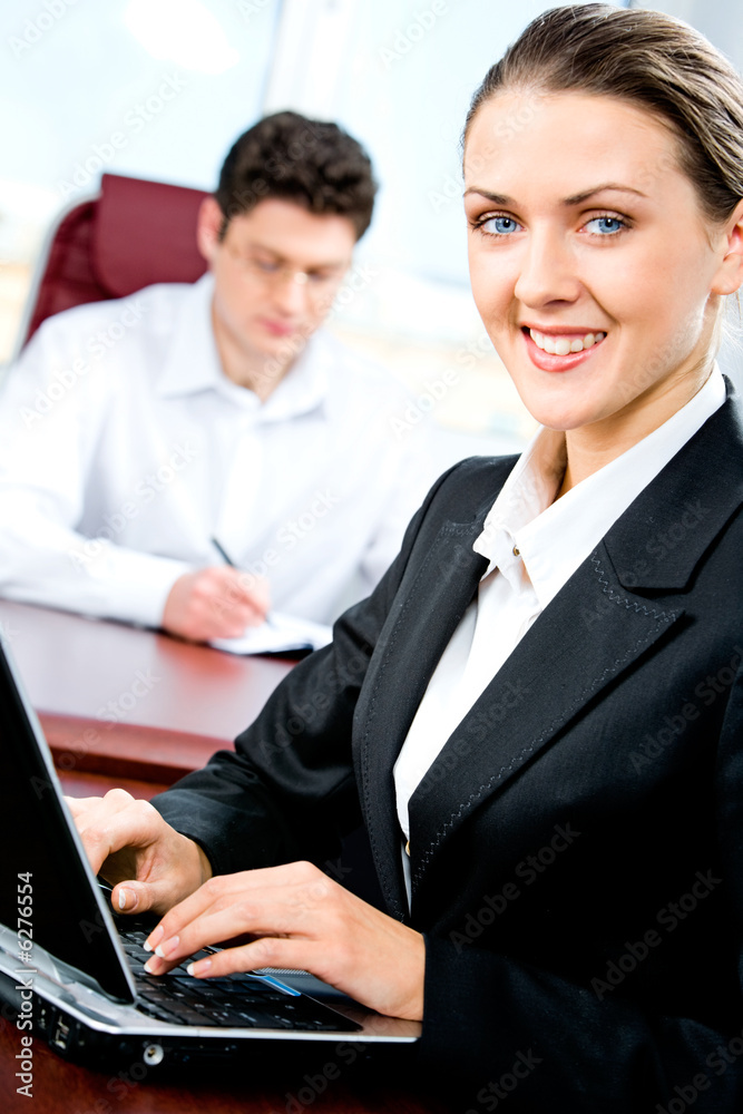 Portrait of professional typing a text in the office Portrait of professional typing a text in the office