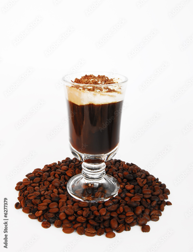 Cup of coffee with milk and grain on a white backg Cup of coffee with milk and grain on a white backg