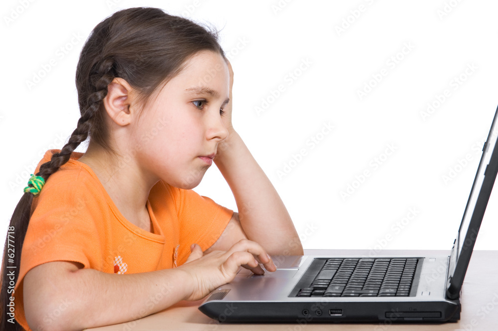 Young girl having with computer game.. Young girl having with computer game..