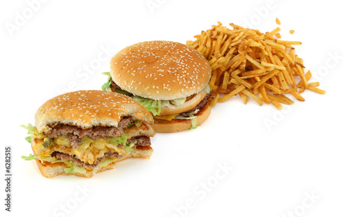 french fries and hamburgers against white background