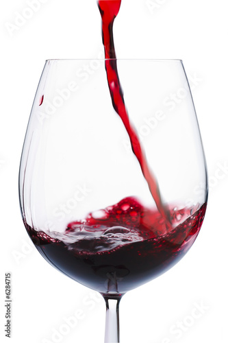 Badly poured red wine in the glass