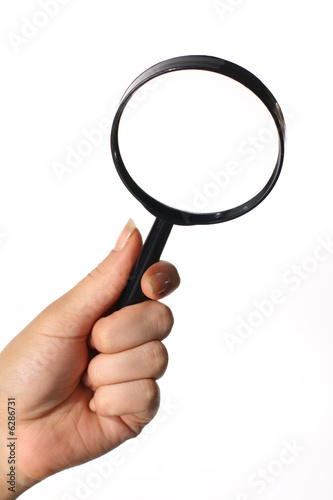 looking magnifier hand take in fingers