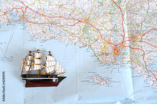 Model of ship on background of map photo