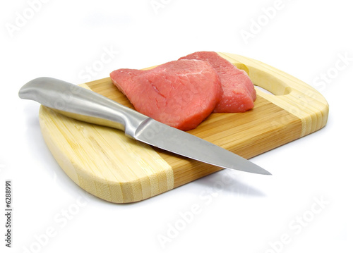 meat and knife food on the board isolated over white
