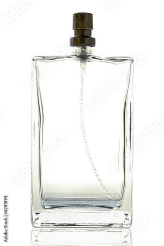 an almost empty perfume bottle on white
