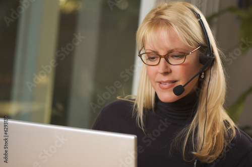 Vászonkép Attractive Businesswoman with Phone Headset