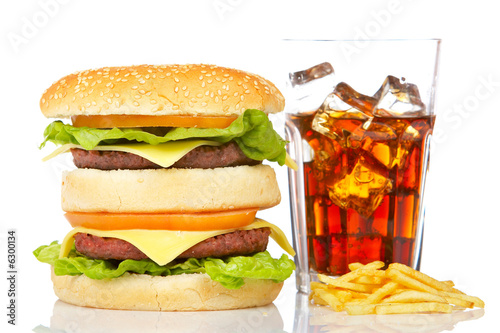 Hamburger and soda, reflected on white background. Shallow DOF