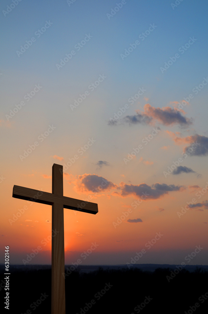 Wooden cross suring a colorful sunset Wooden cross suring a colorful sunset