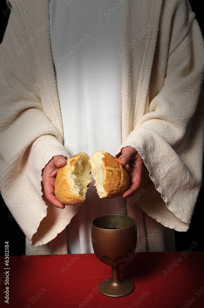 Jesus breaking bread as a symbol of Communion StockFoto Adobe Stock
