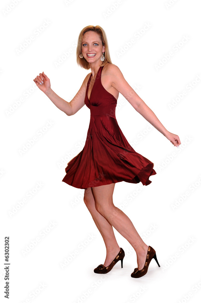 Fototapeta premium Beautiful woman in red dress expressing happiness