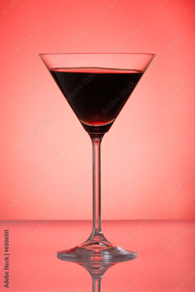 Pomegranate cocktail on red background Pomegranate cocktail on red background