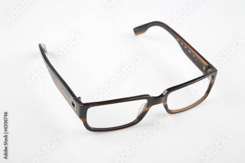 pair of brown spectacles on bright background