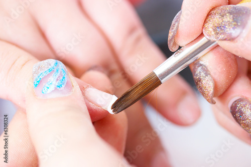 Correction of nails using acrylic . French manicure