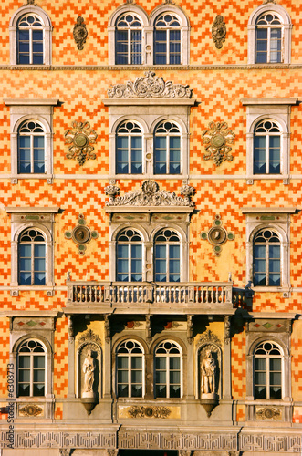 Antique building facade at sunset