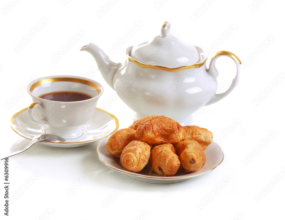 cup of tea and croissants on white cup of tea and croissants on white