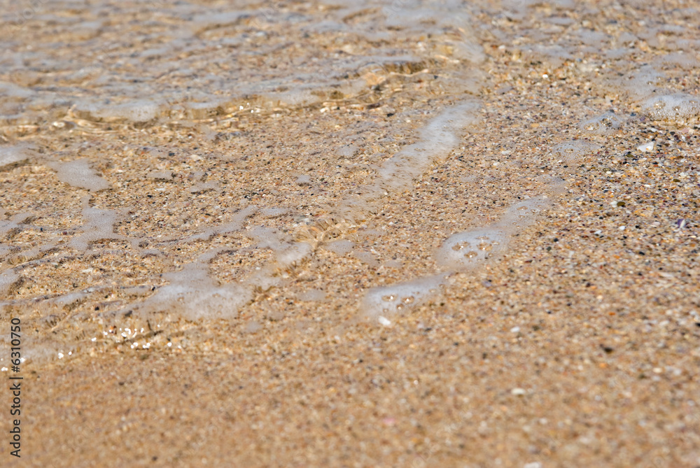 gentle water just comes over the sand gentle water just comes over the sand