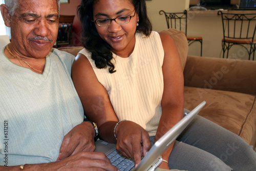 Father and Daughter on Comp...