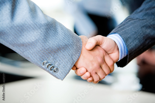 Close-up of two businessmen’s handshake