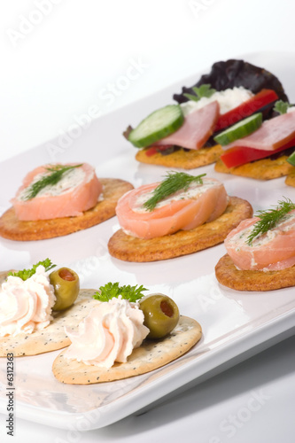 Tray with fresh sandwiches on holiday table.