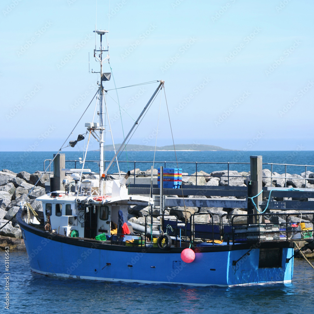 fishing boat docked in harbour