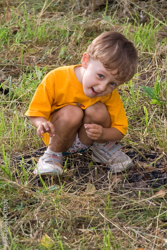 boy in orange on nature (1)