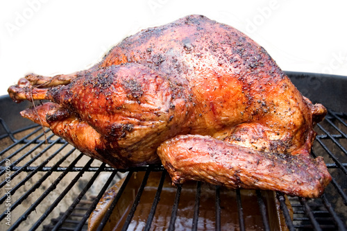 a big juicy turkey on the grill