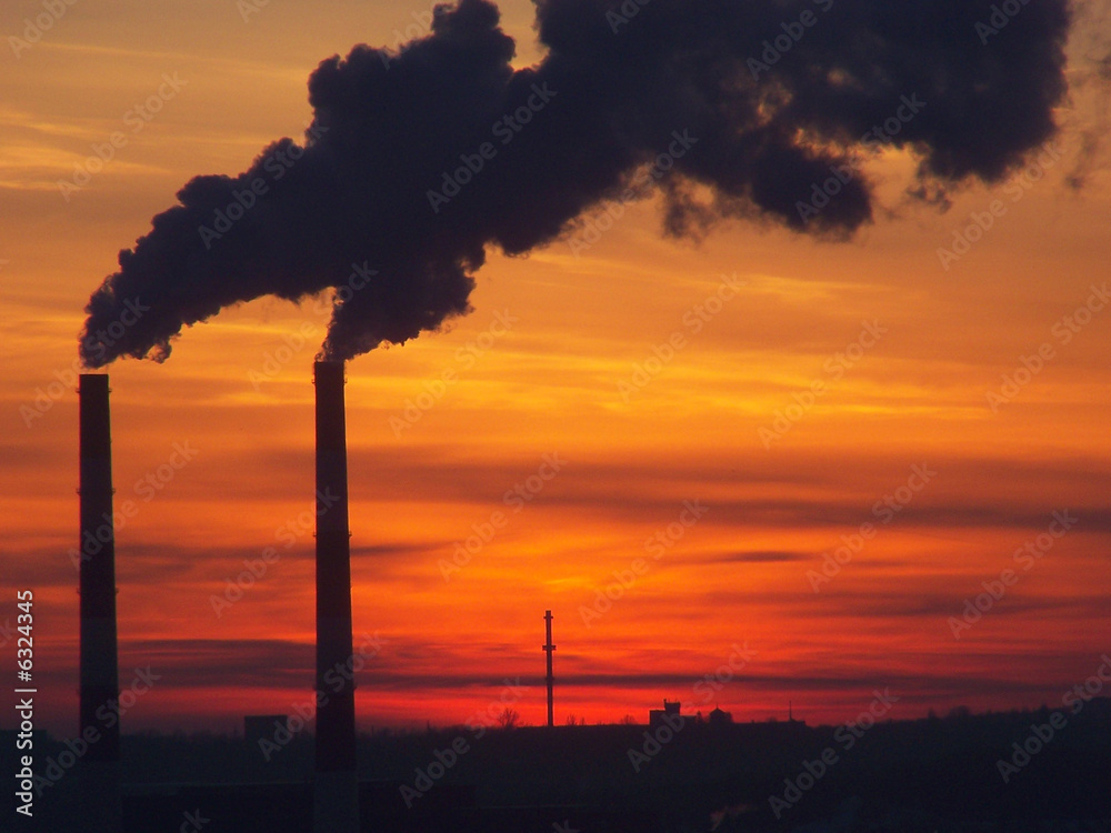 Industrial smoke and bright sunset