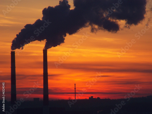 Industrial smoke and bright sunset