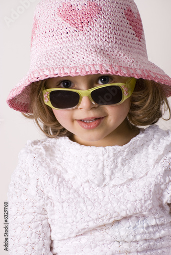 Little girl in summer hat photo