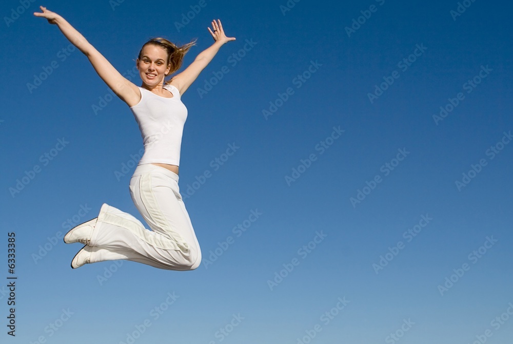 happy fit healthy woman jumping for joy happy fit healthy woman jumping for joy