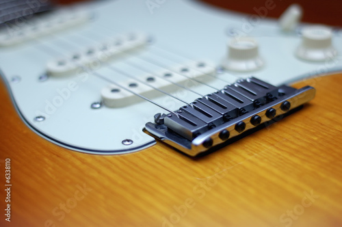 Close-up of a Fender American Deluxe guitar bridge