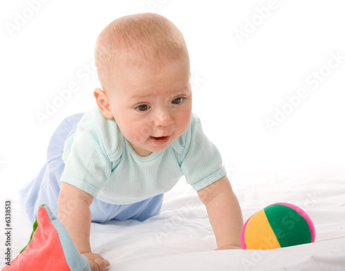 small boy with toys on a white background