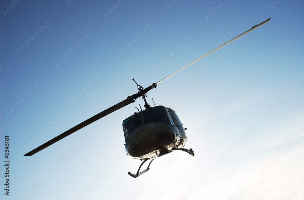 Silhouette of military helicopter on a mission Silhouette of military helicopter on a mission