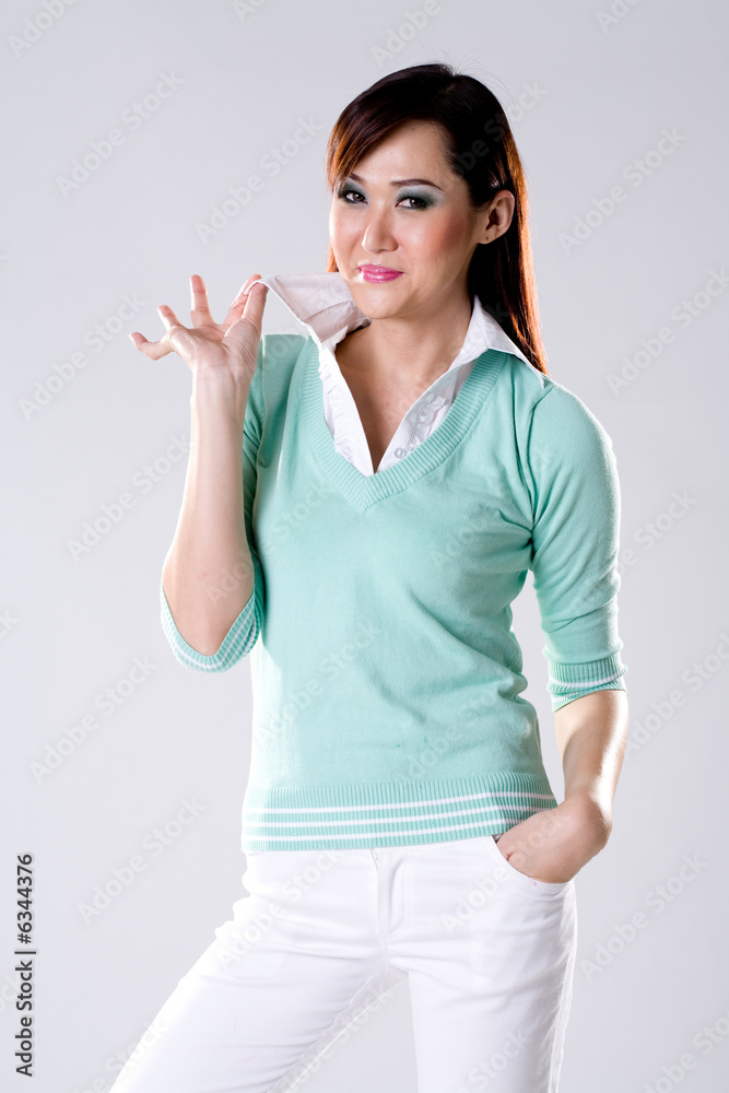 Beautiful aqua top woman with hand on collar Beautiful aqua top woman with hand on collar