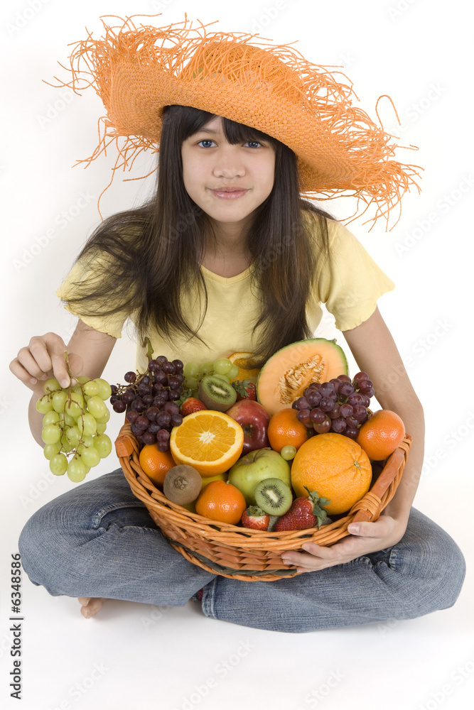Teenager with fruit basket before white background Teenager with fruit basket before white background