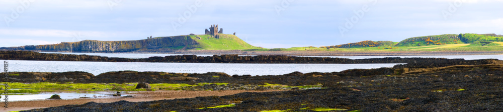 Panorama of Embleton Bay with view of Dunstanburgh Castle