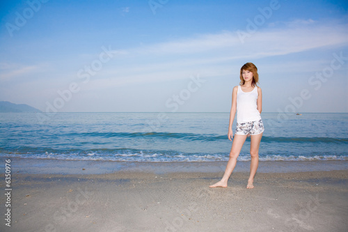 woman having fun by the beach